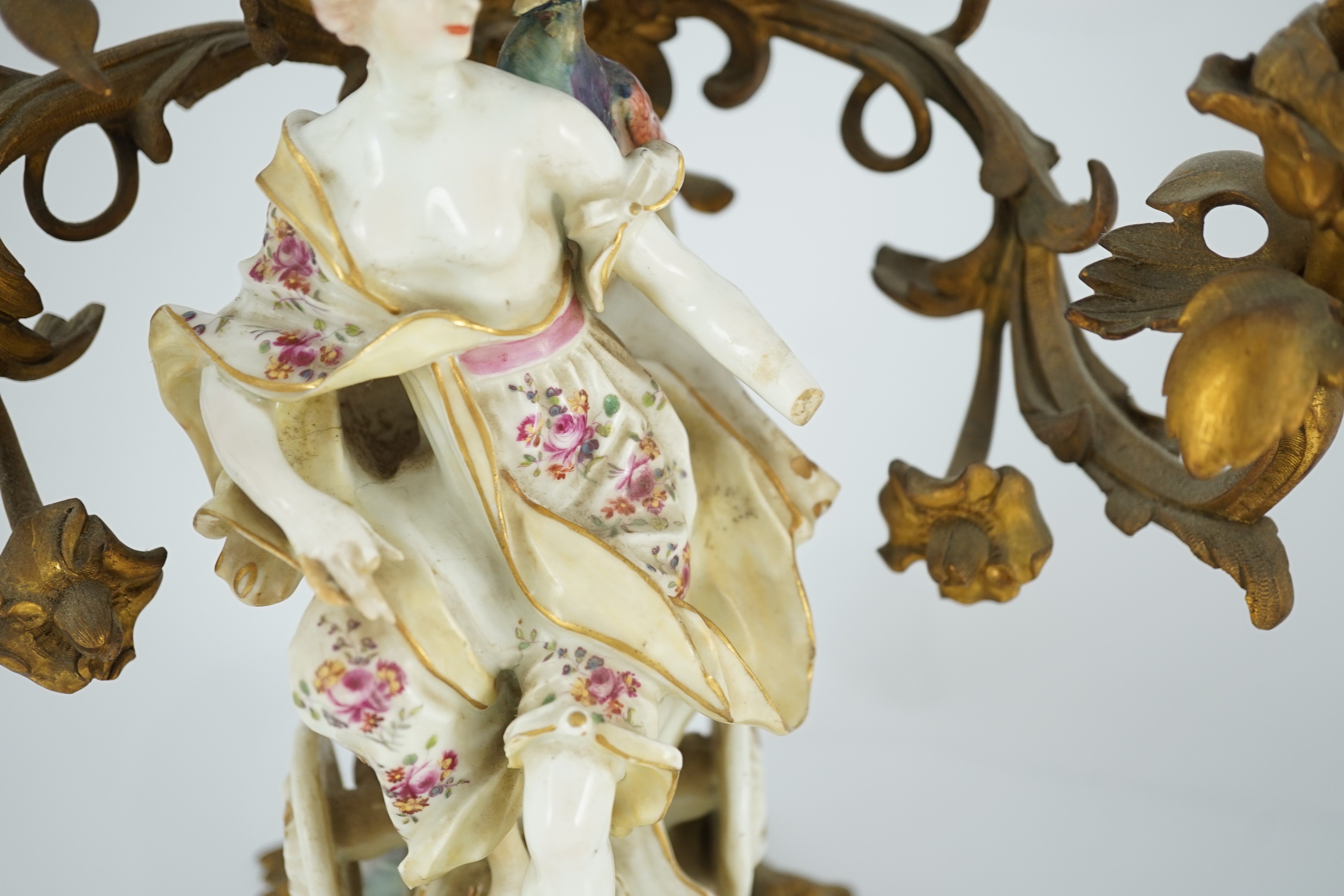 A pair of large Derby porcelain and ormolu mounted ‘Juno and Jupiter’ figural candelabra, the figures c.1760